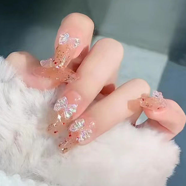 Glamorous artificial nails with delicate flower and glitter effects Bowlift