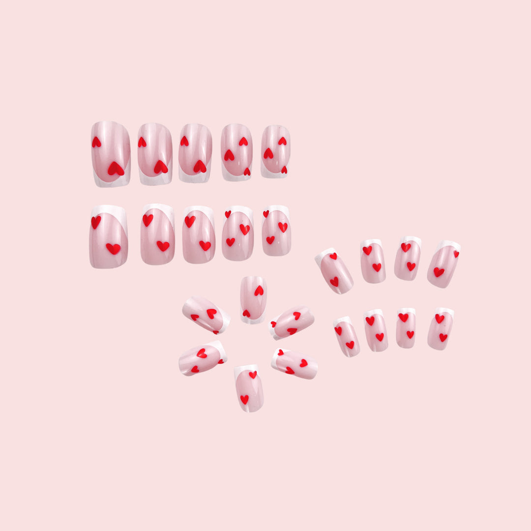 Heart-Embellished French Tip Nail Art Bowlift