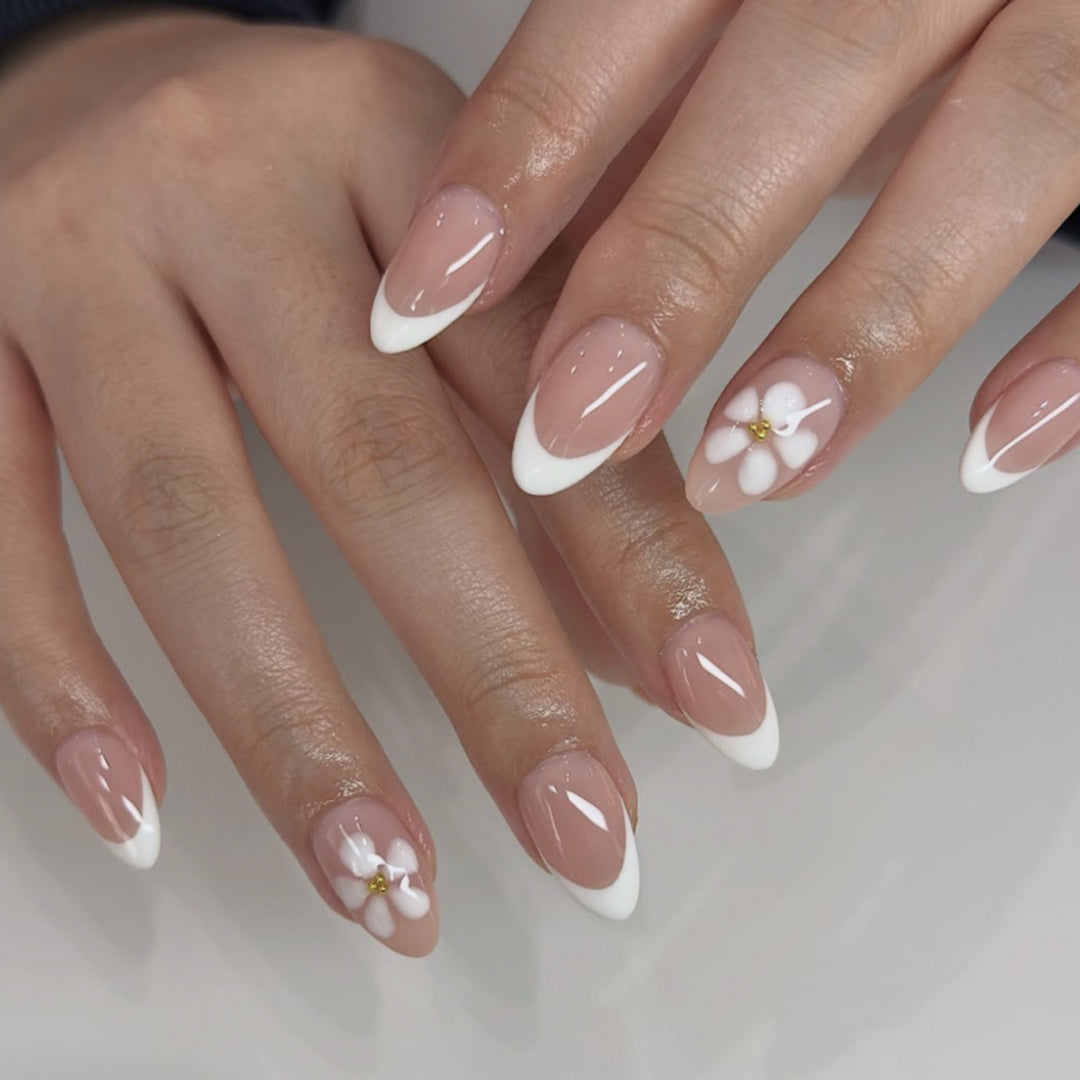Artful nail extensions with flower design and elegant French tips Bowlift