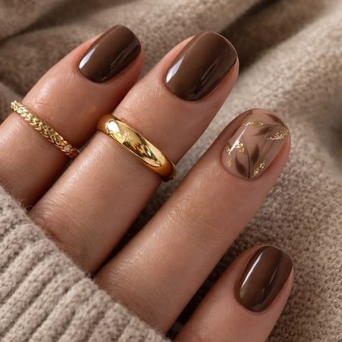 Nail set with elegant marble design and golden accents Bowlift