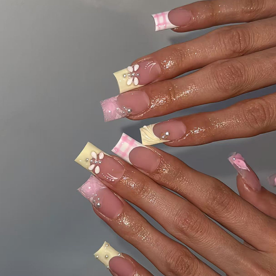 Artificial nails with creative floral designs and glitter accents Bowlift