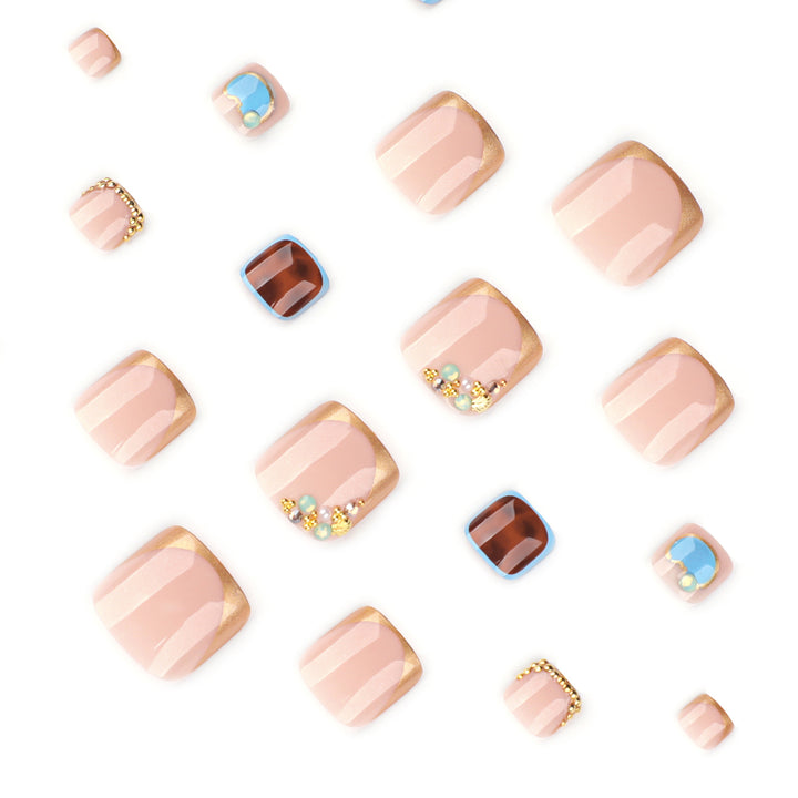 Artistic toenail art with elegant gold design Bowlift