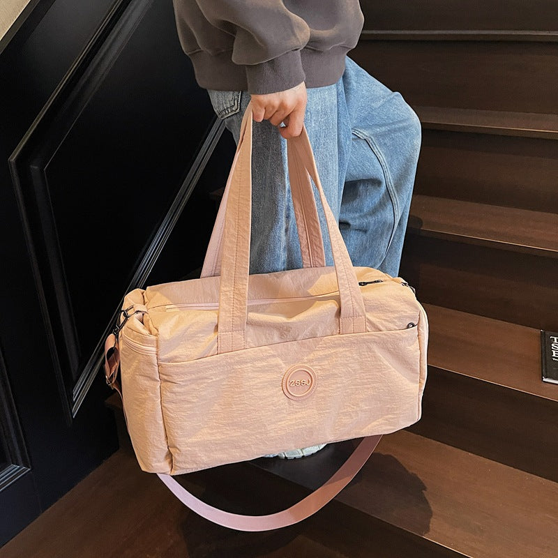 Sporty travel bag with practical exterior pockets Bowlift