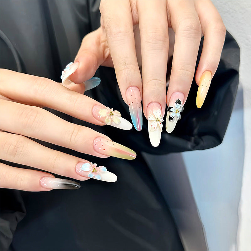 Artificial nail set with floral and glittering decorations Bowlift