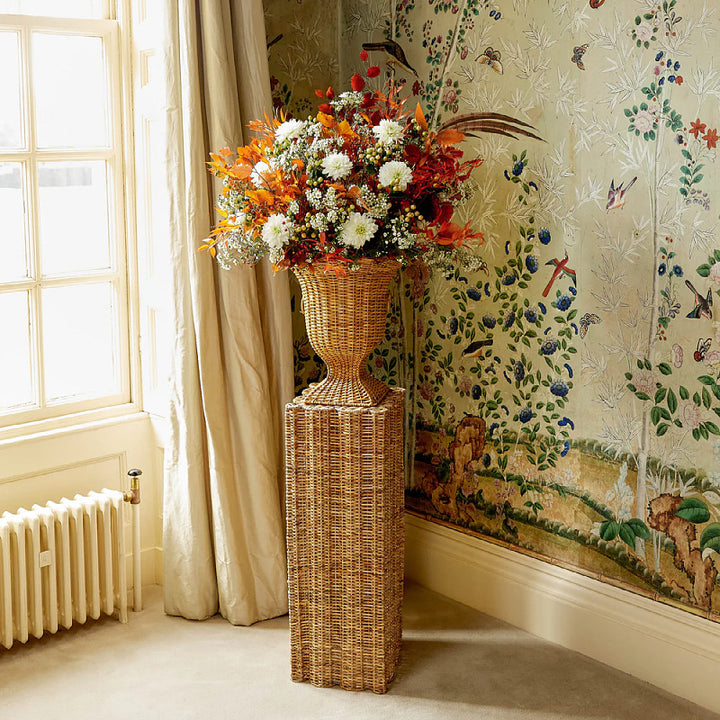 Decorative plant pot stand made of woven material Bowlift