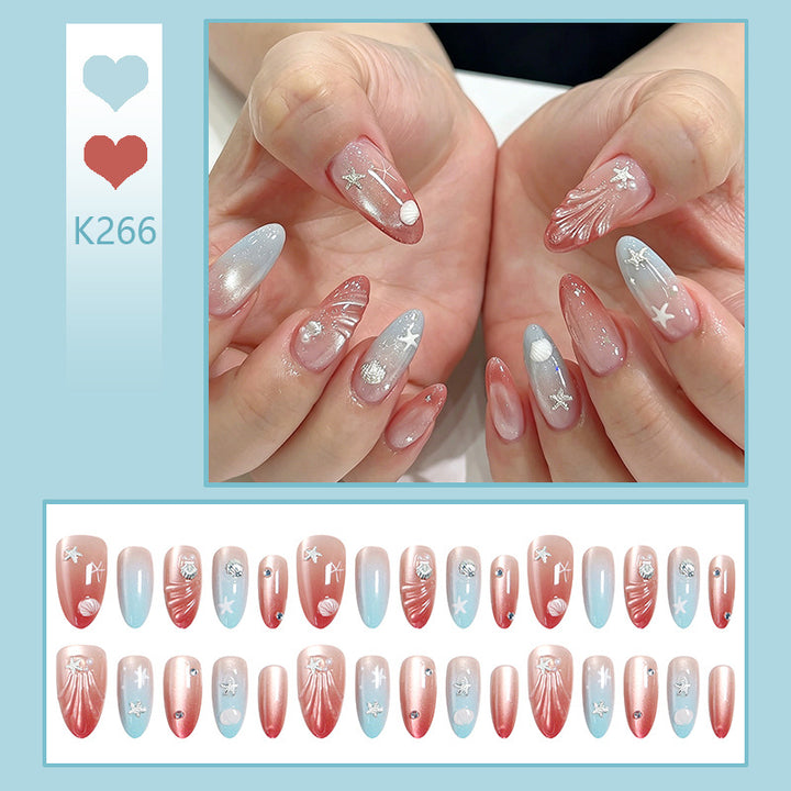 Artificial nails with sparkling rhinestone embellishments and maritime design Bowlift
