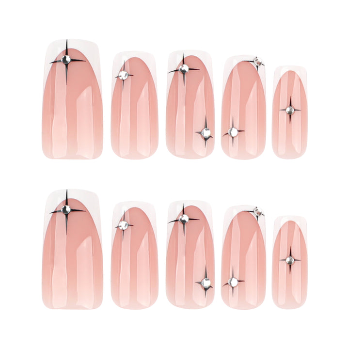 Artificial nail extensions with elegant French tip and glitter accents Bowlift