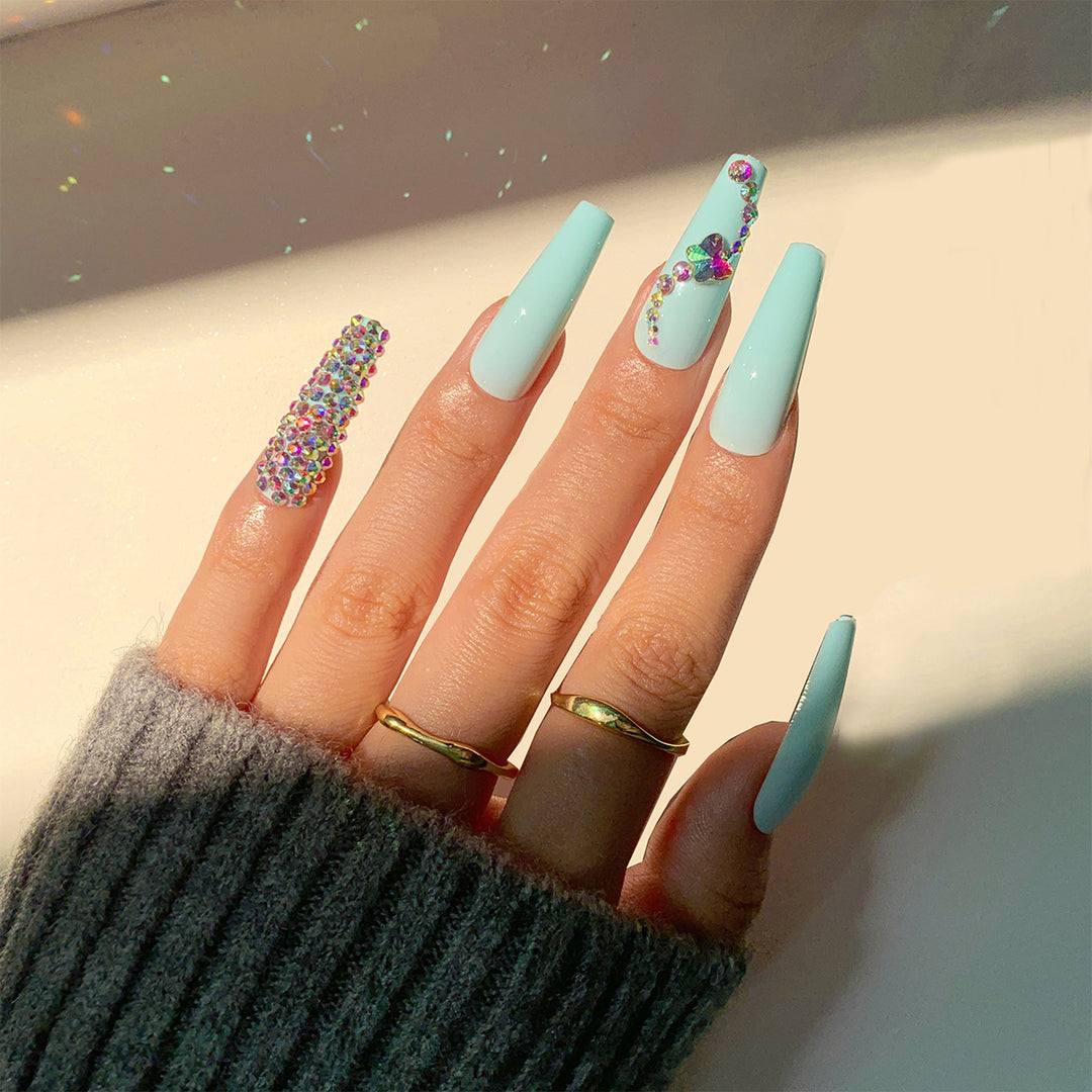 Glamorous artificial nails with sparkling rhinestone embellishments Bowlift