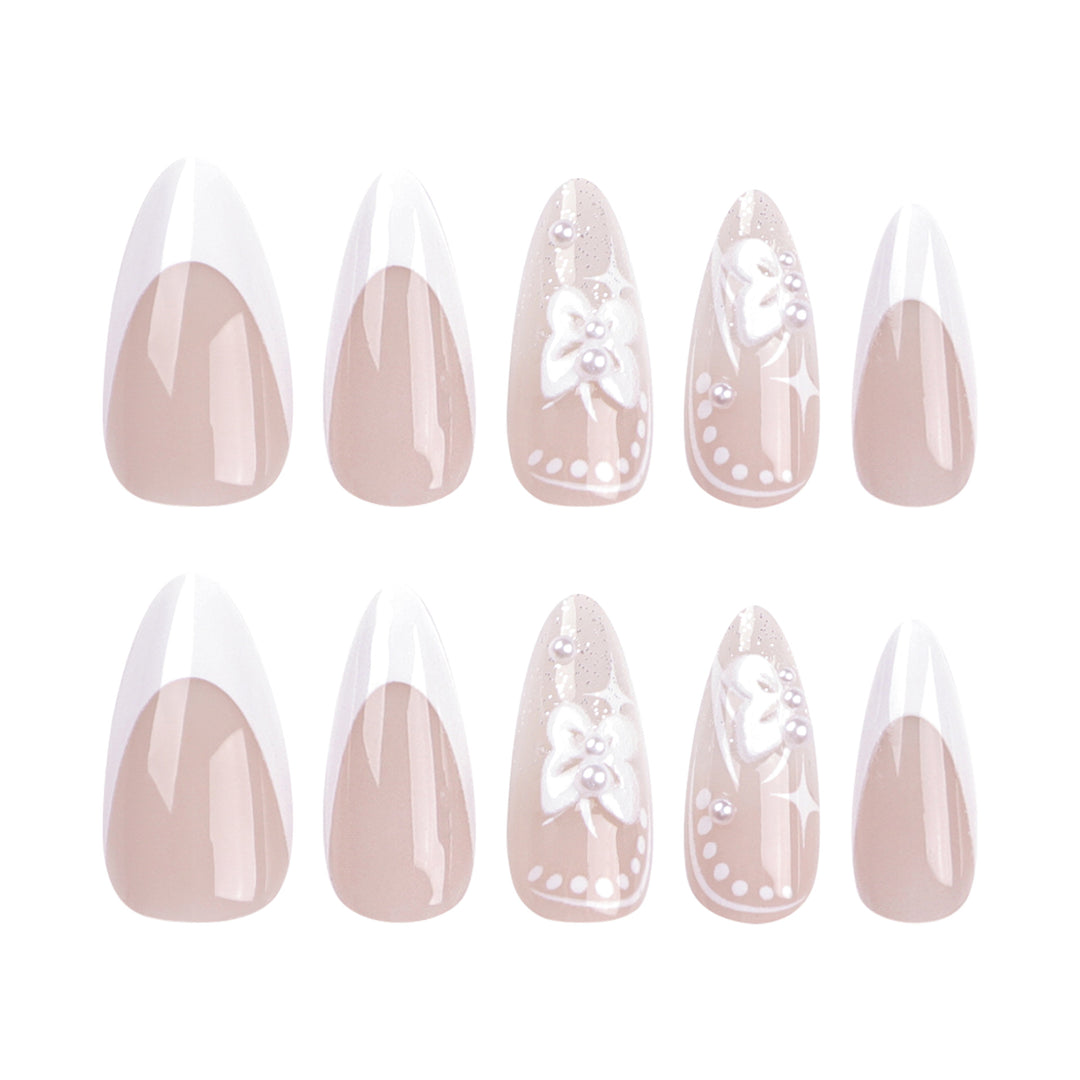 Artful stiletto nails with floral designs and glitter accents Bowlift