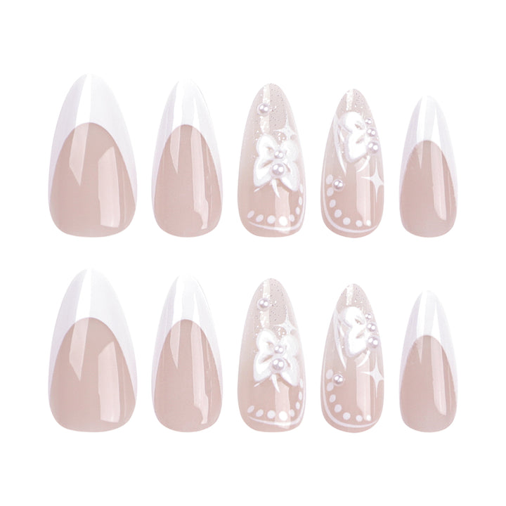 Artful stiletto nails with floral designs and glitter accents Bowlift