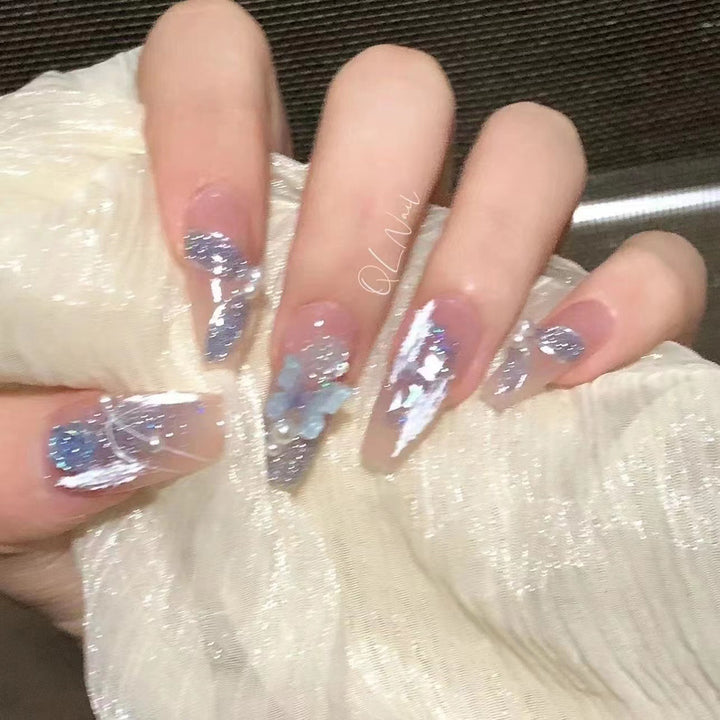 Artistic 3D nail extensions with glitter accents Bowlift