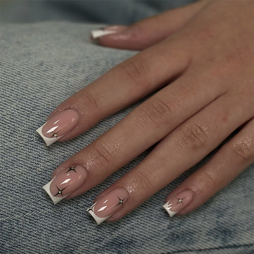 Artificial nail extensions with elegant French tip and glitter accents Bowlift