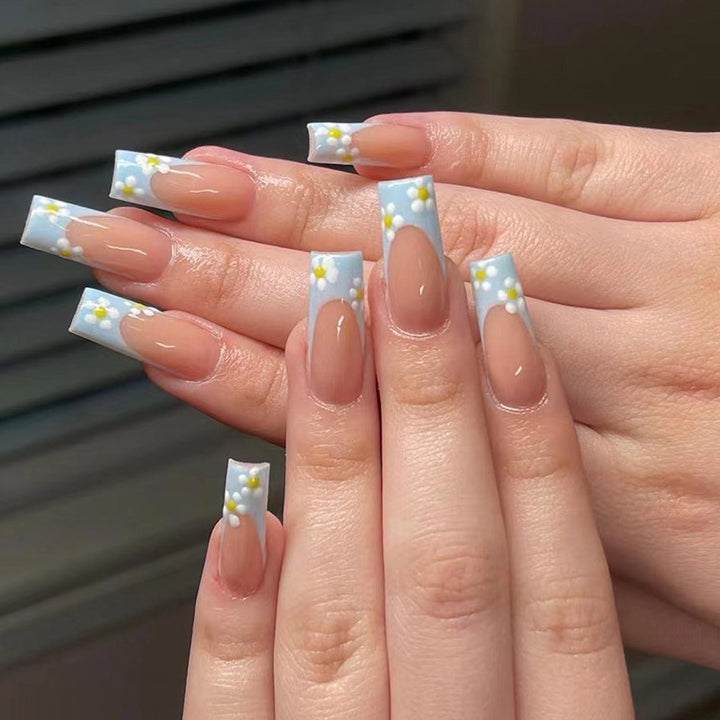 Artful Gel Nails with Elegant Floral Design and Glitter Accents Bowlift
