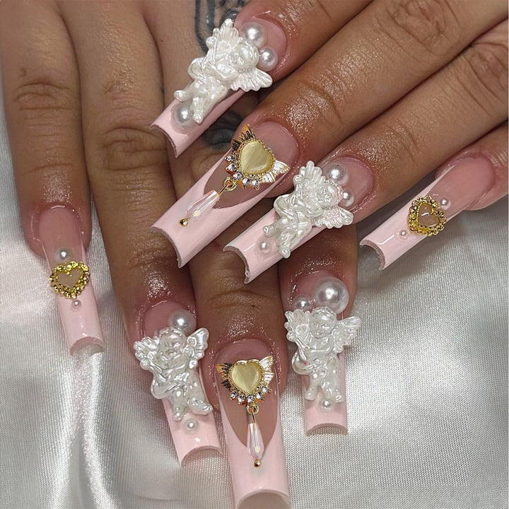 Creative acrylic nail set with delicate pearl and gloss accents Bowlift
