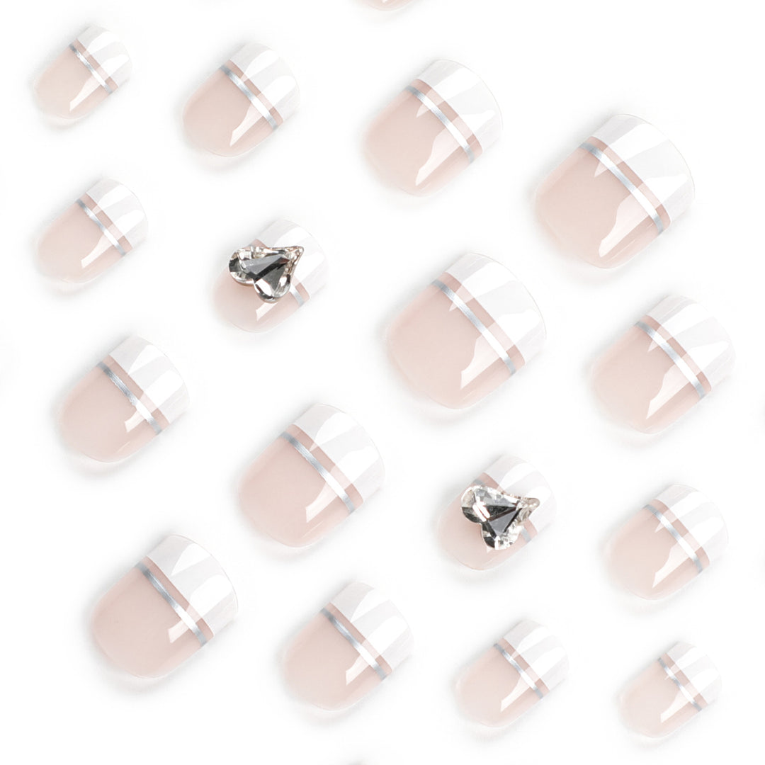 Elegant Nail Art with Glitter Accents and Jewelry Details Bowlift