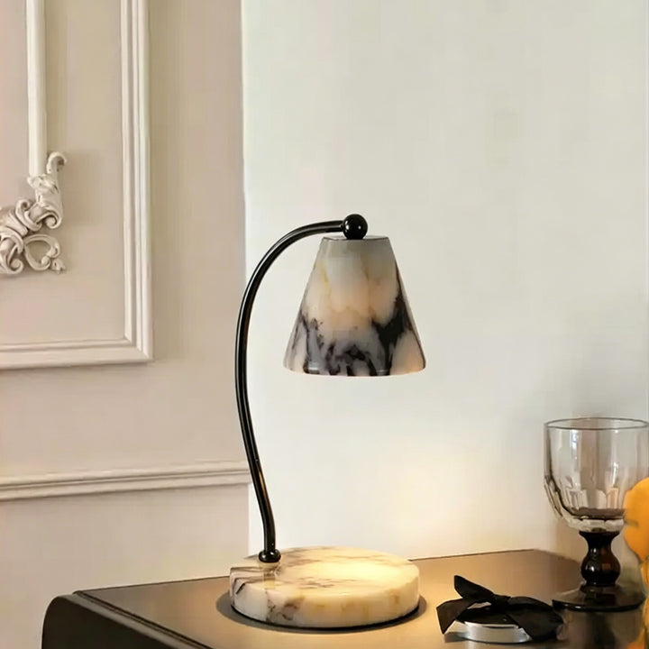 Marble bedside lamp with integrated candle tray and curved metal arm Bowlift