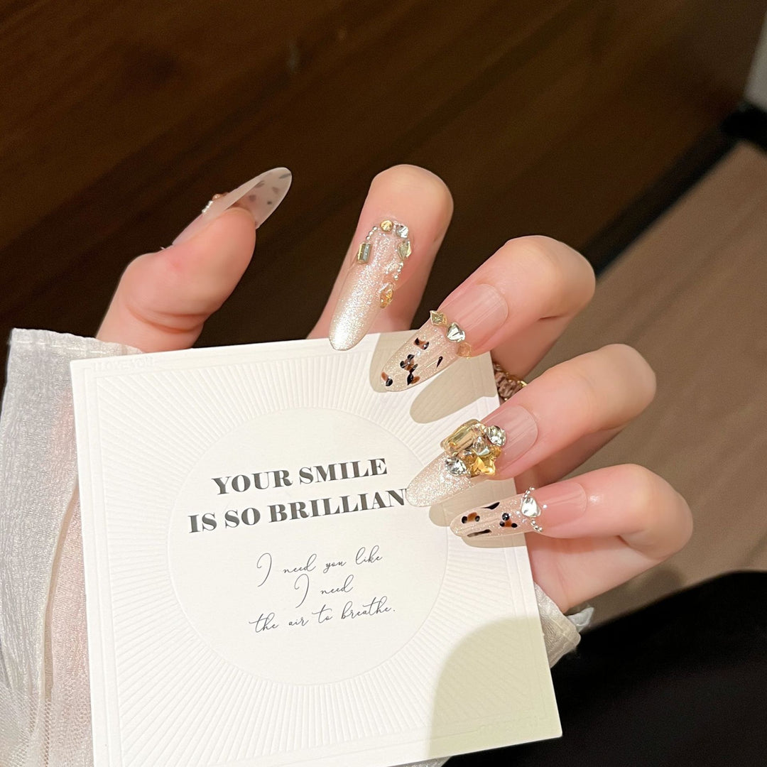 Artistic Stiletto Press-On Nail Art with Glimmering Accents Bowlift