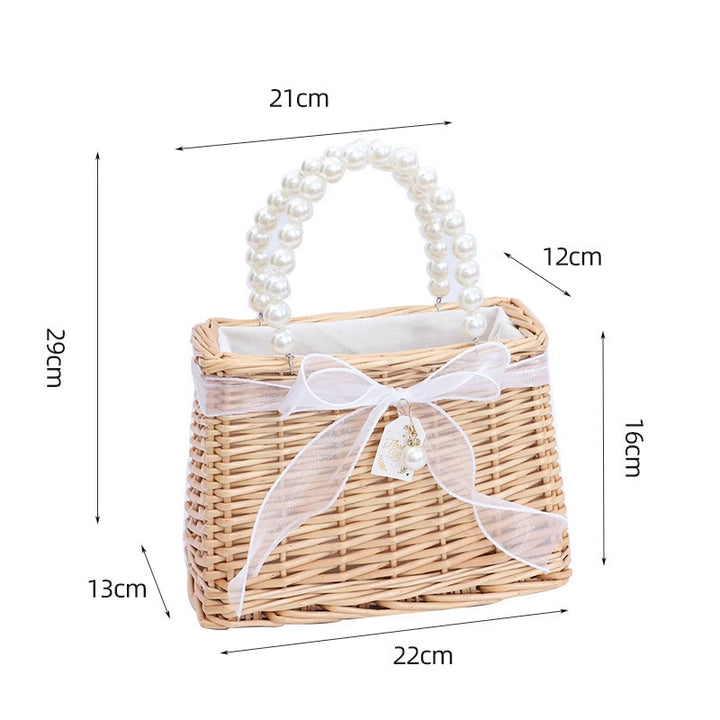 Ladies handbag made of braided material with elegant pearl handles Bowlift