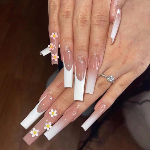 Artful nail extensions with elegant gradient and creative floral accents Bowlift