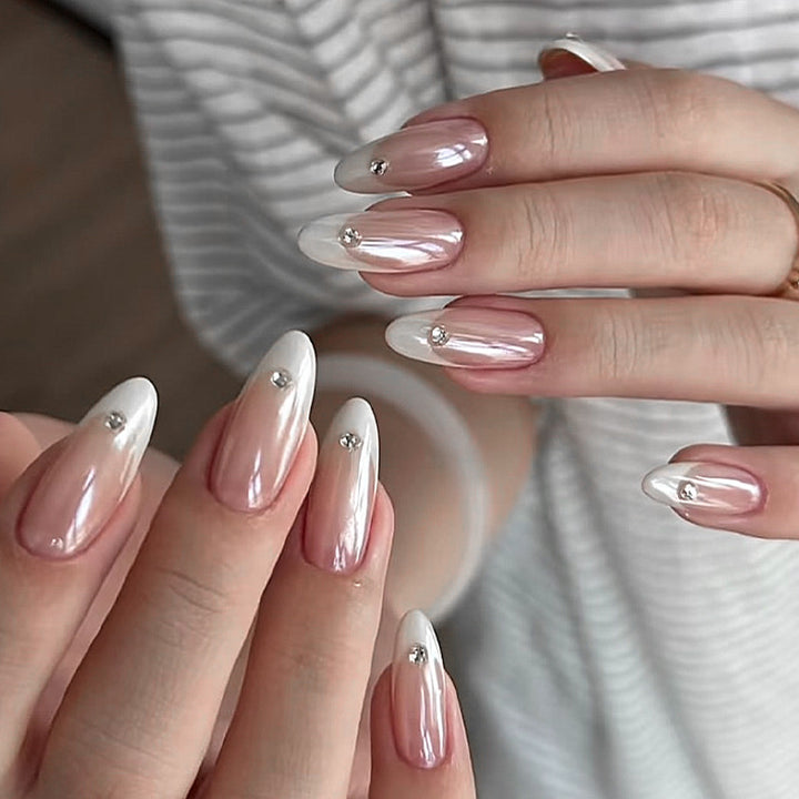 Artificial nail set with elegant French tips and glitter accents Bowlift