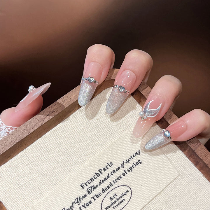 Artistic Stiletto Press-On Nail Art with Glimmering Accents Bowlift