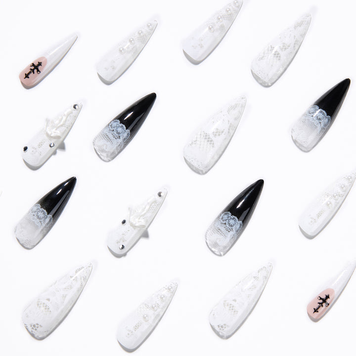 Artful stiletto nails with unique 3D elements and glitter accents Bowlift