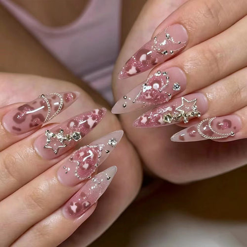 Artistic stiletto nails with glitter and jewelry accents Bowlift