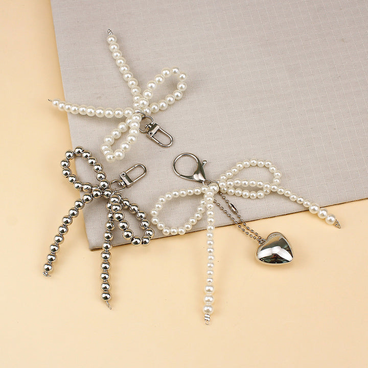 Elegant Pearl Bow Brooch Bowlift
