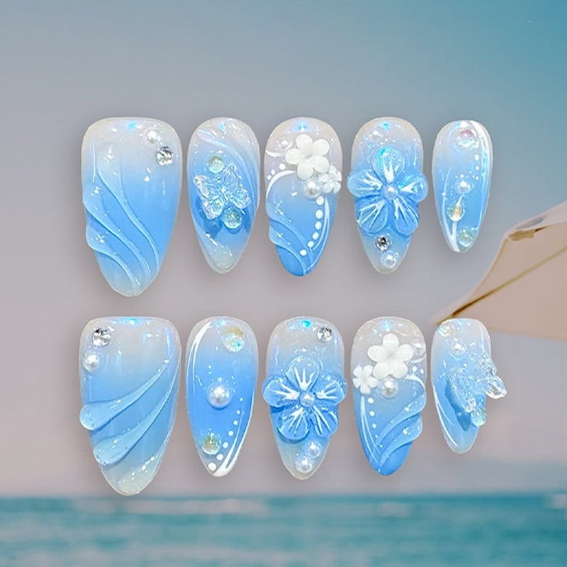 Creative nail set with floral accents and glittering details Bowlift