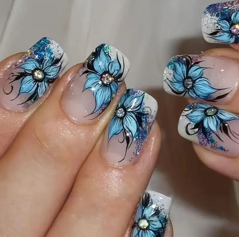 Artificial nail set with intricate floral designs and glitter elements Bowlift