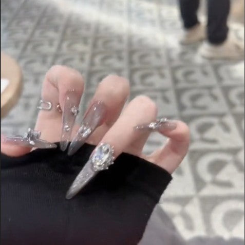 Glamorous artificial nails with rhinestone accents Bowlift