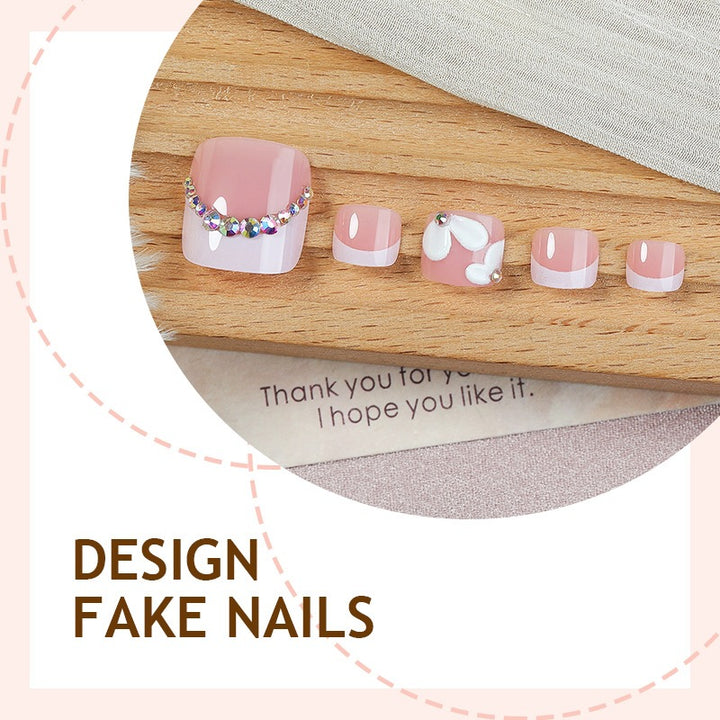 Creative nail art set with elegant flower designs and glitter accents Bowlift