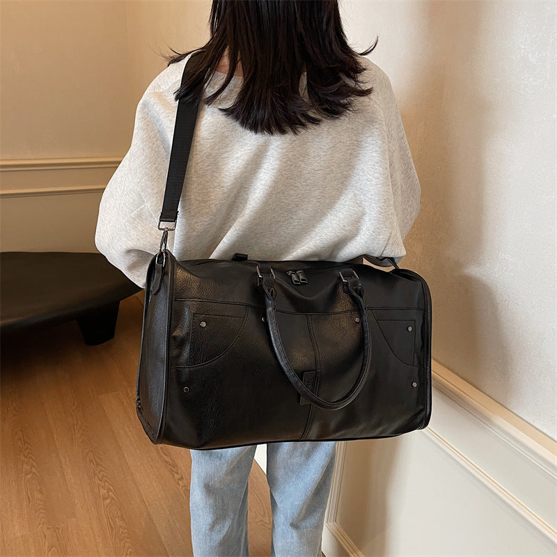 Elegant leather bag with stylish design and versatile carrying options Bowlift