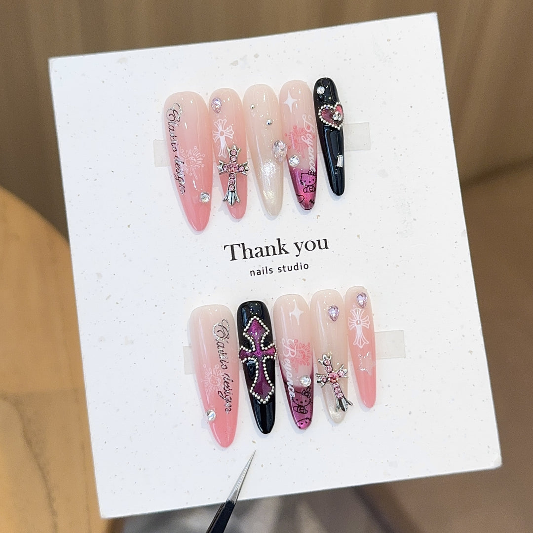 Artificial nails with glamorous accents and sparkling embellishments Bowlift
