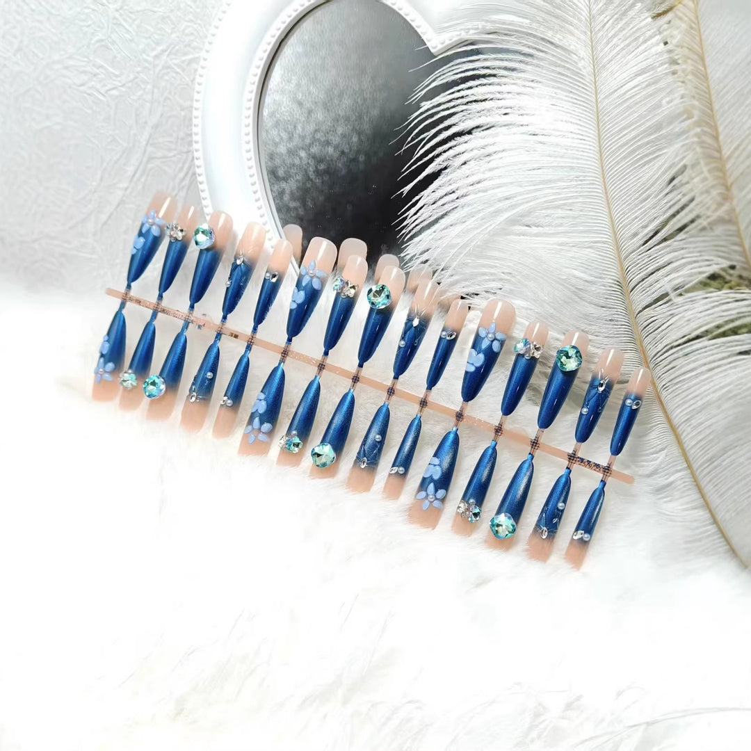 Elegant artificial nails with floral applications and glitter elements Bowlift