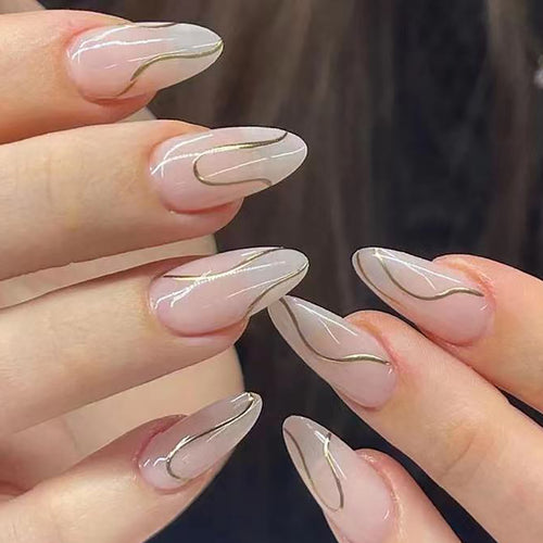 Artistic Stiletto Press-On Nails with Elegant Gold Accents Bowlift