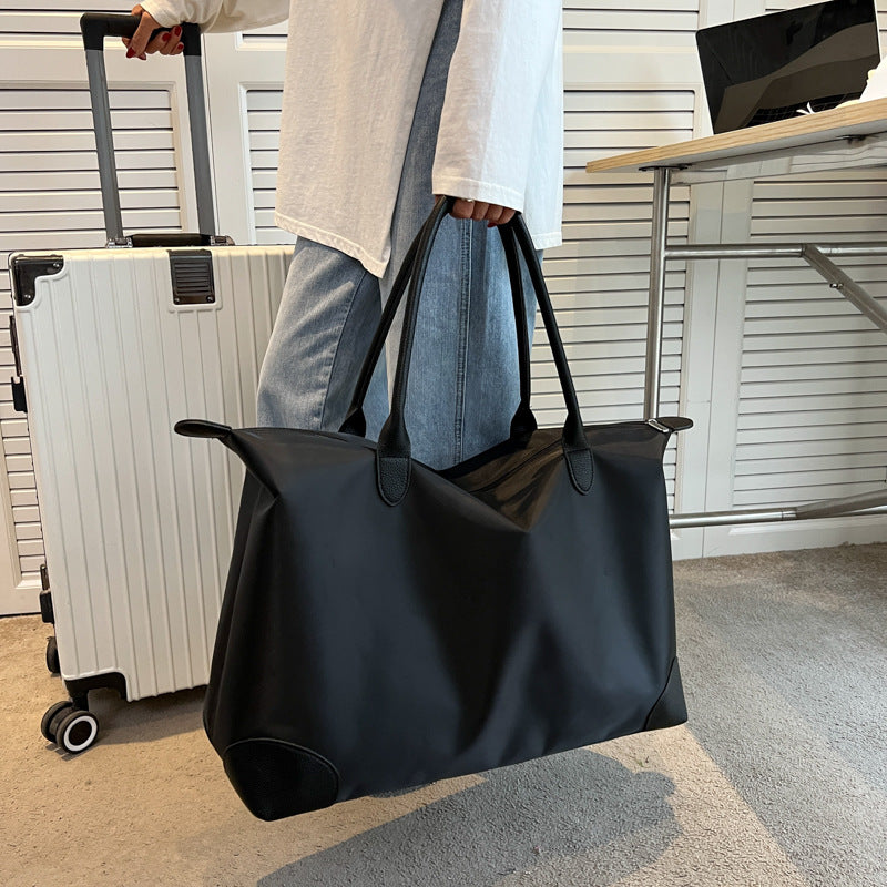 Large travel bag with durable material and multiple compartments Bowlift
