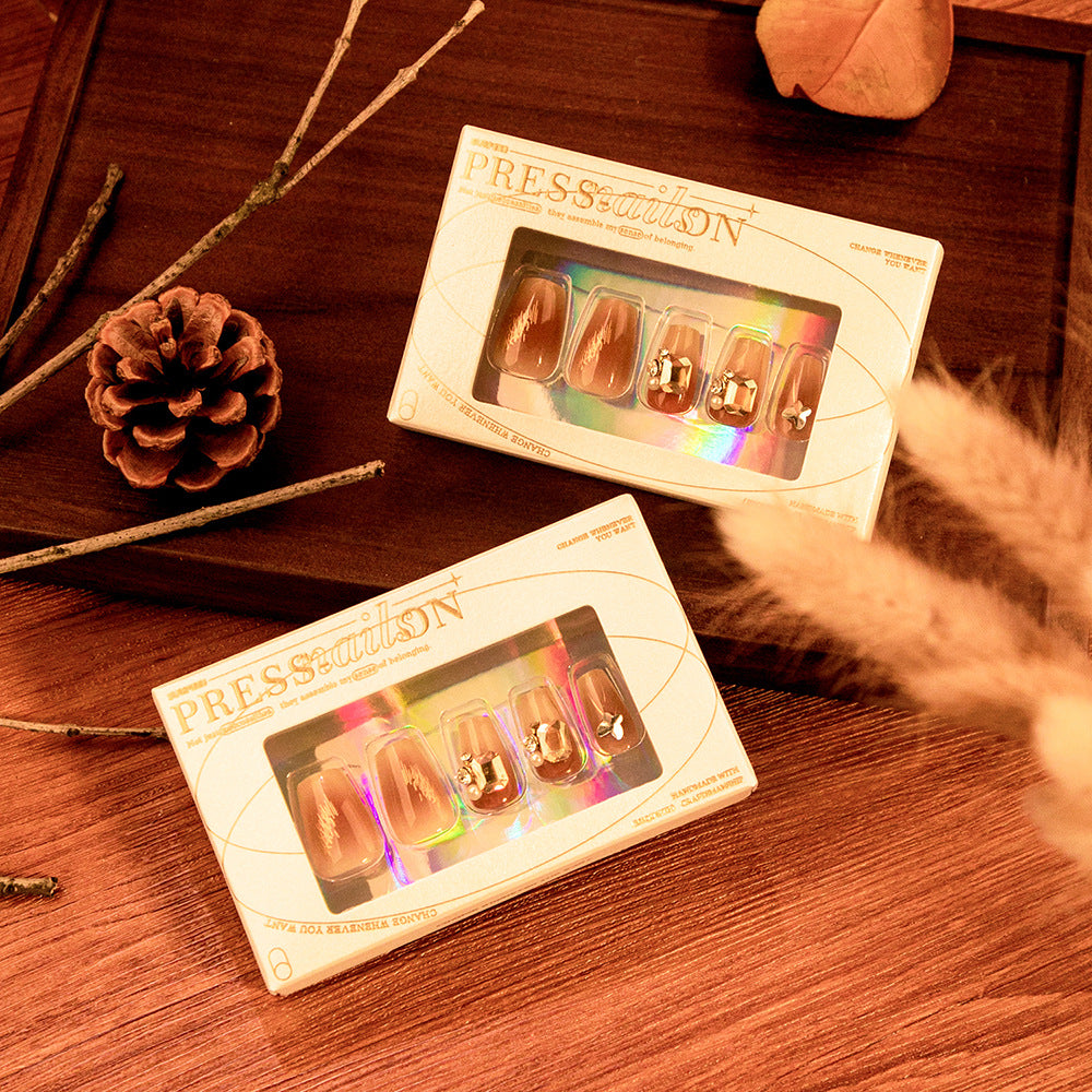 Artificial nail art with elegant jewelry accents Bowlift