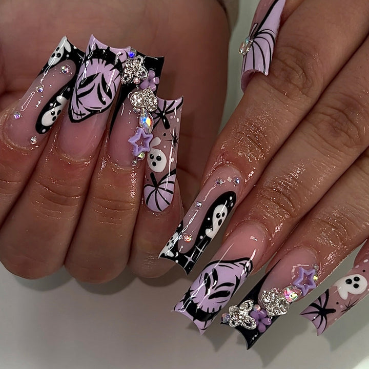 Artificail nails with creative Halloween design and glitter accents Bowlift