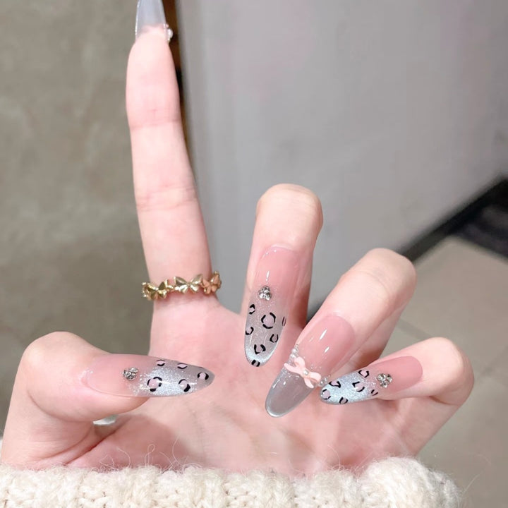 Artistic Stiletto Press-On Nail Set with Leopard Print and Bow Accents Bowlift