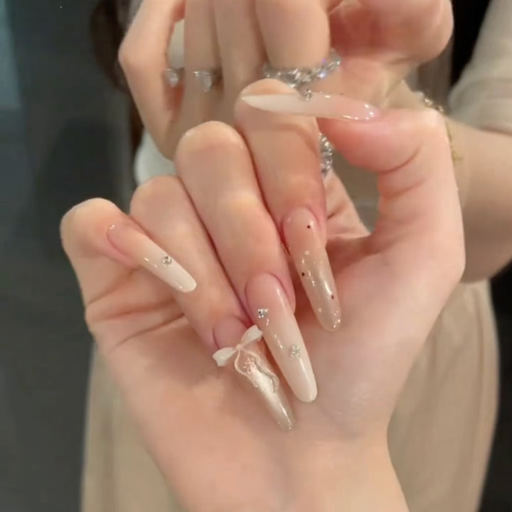 Elegant Stiletto Press-On Nail Set with Decorative Accents Bowlift