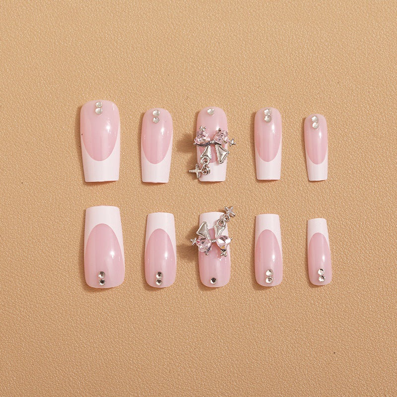 Artificial nail set with luxurious French tips and elegant embellishments Bowlift