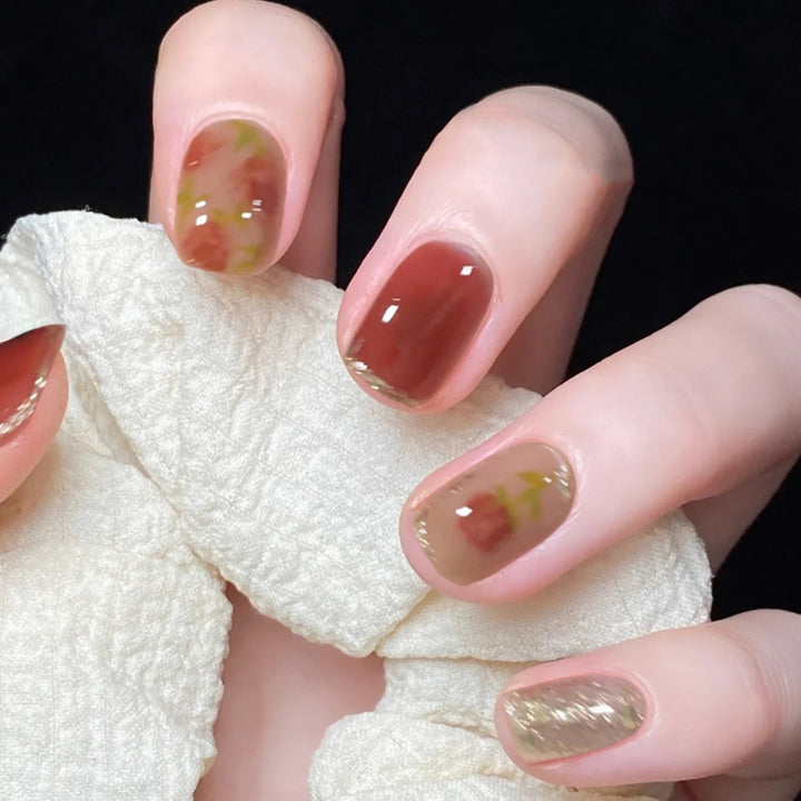 Artful nail art with natural gradient and floral accents Bowlift