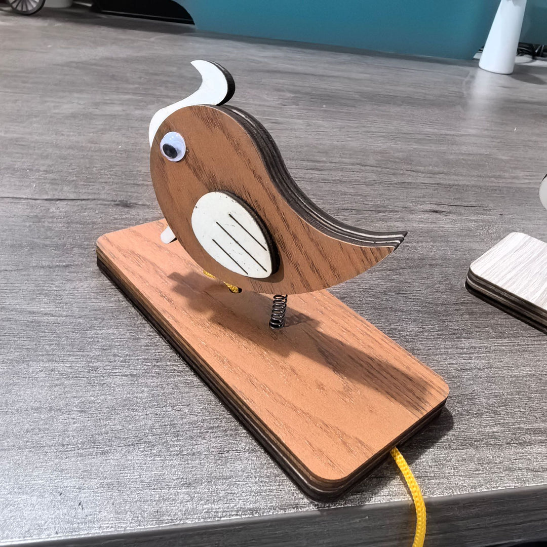 Unisex nan movable wooden bird table figure made of plywood with spiral spring and pull line Bowlift