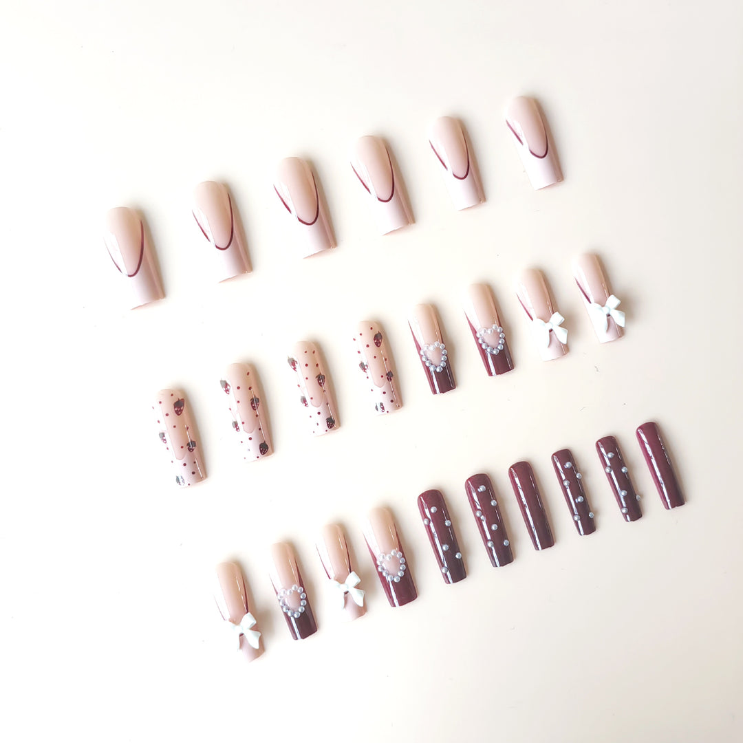 Artificial artificial nails with heart designs and holographic accents Bowlift