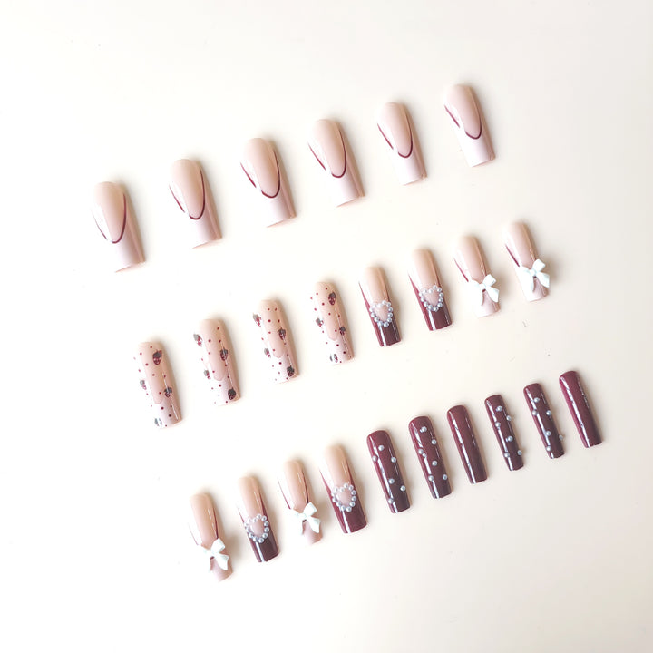 Artificial artificial nails with heart designs and holographic accents Bowlift