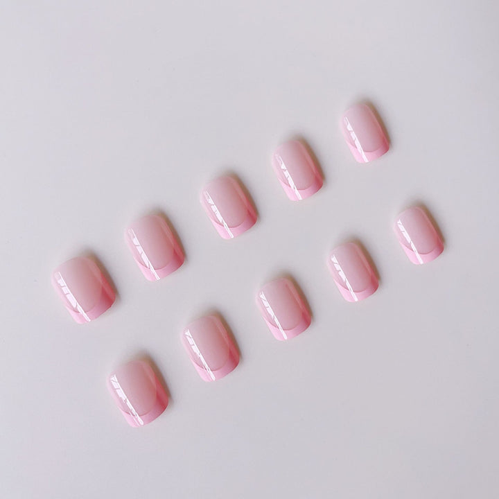 Artificial nail set with modern French tips and elegant shine Bowlift