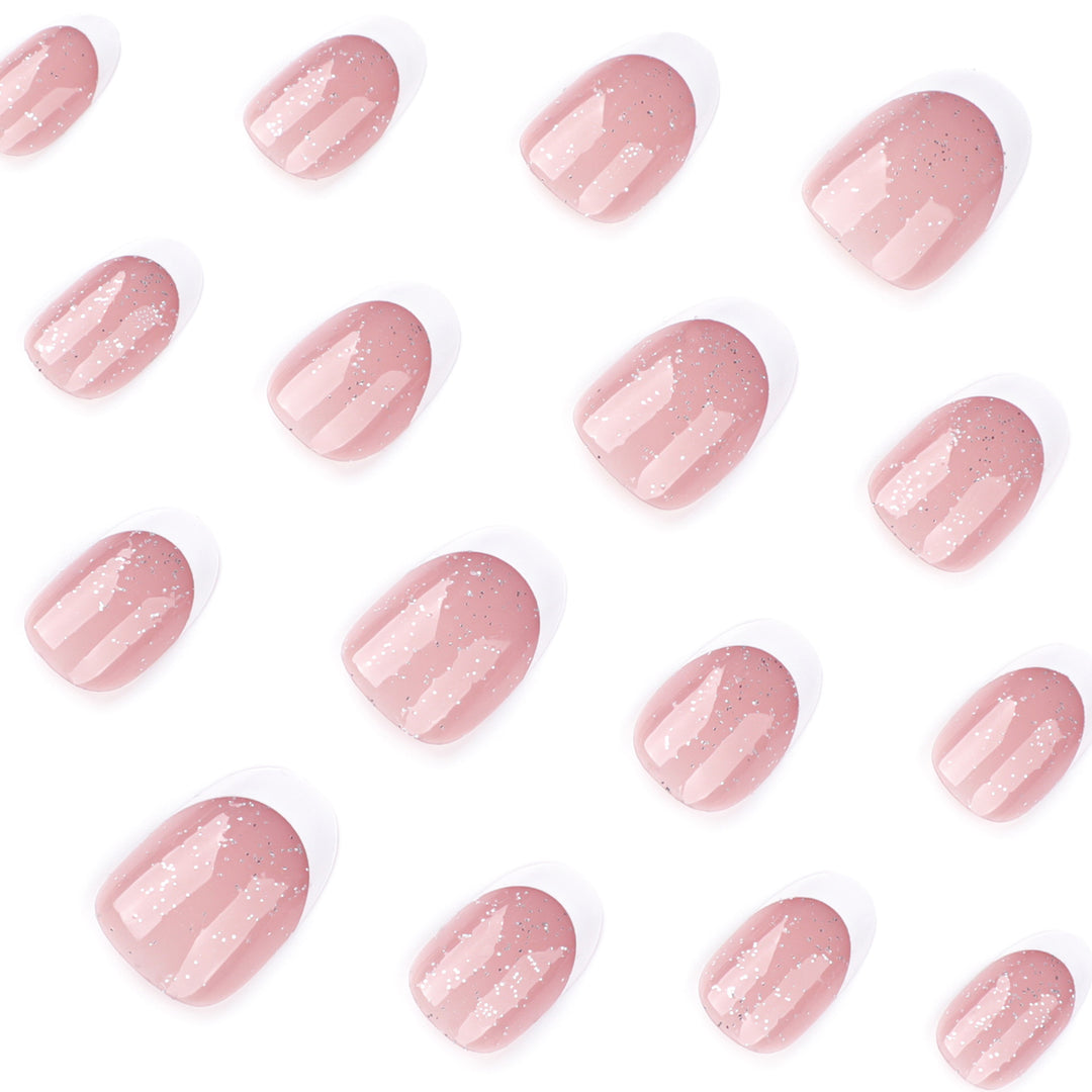 Artful nail art with glitter in gentle tones and elegant tips Bowlift