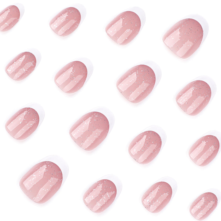 Artful nail art with glitter in gentle tones and elegant tips Bowlift