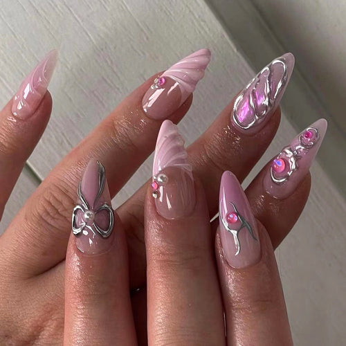 Artful stiletto nails with glitter and pearl decorations Bowlift